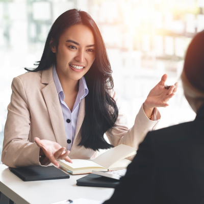 A woman sharing an ASD & ADHD Assessment with a client.